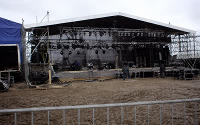A low-resolution stage and truss photograph with dated colours.